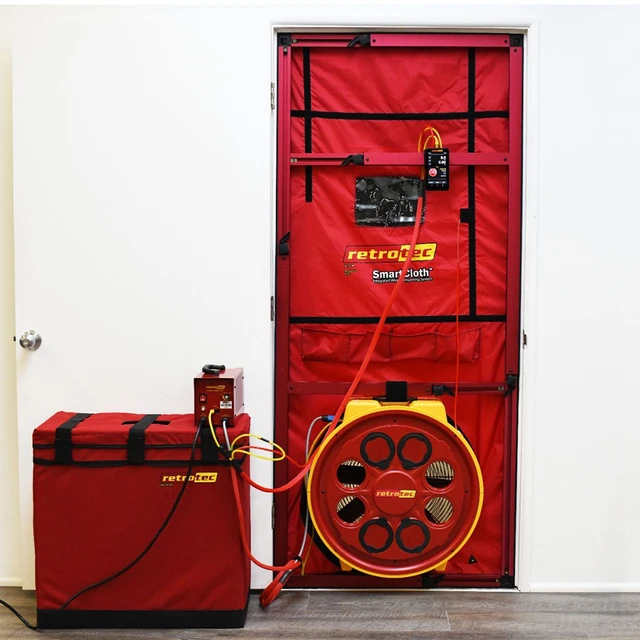 Calibrated blower door fan installed in a Phoenix home doorway during a BPI energy audit