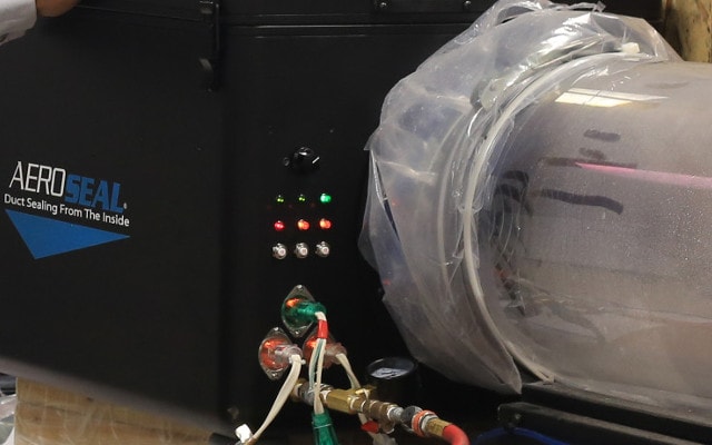 Aeroseal duct sealing equipment connected to a home's duct system